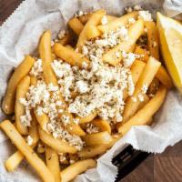 Greek Fries · Fries topped with feta, oregano and a lemon wedge. Vegetarian.