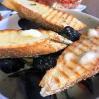 Mussels & Toasted Garlic Bread · A pound of sauteed mussels  made with your choice of spicy red or white sauce and toasted ga...