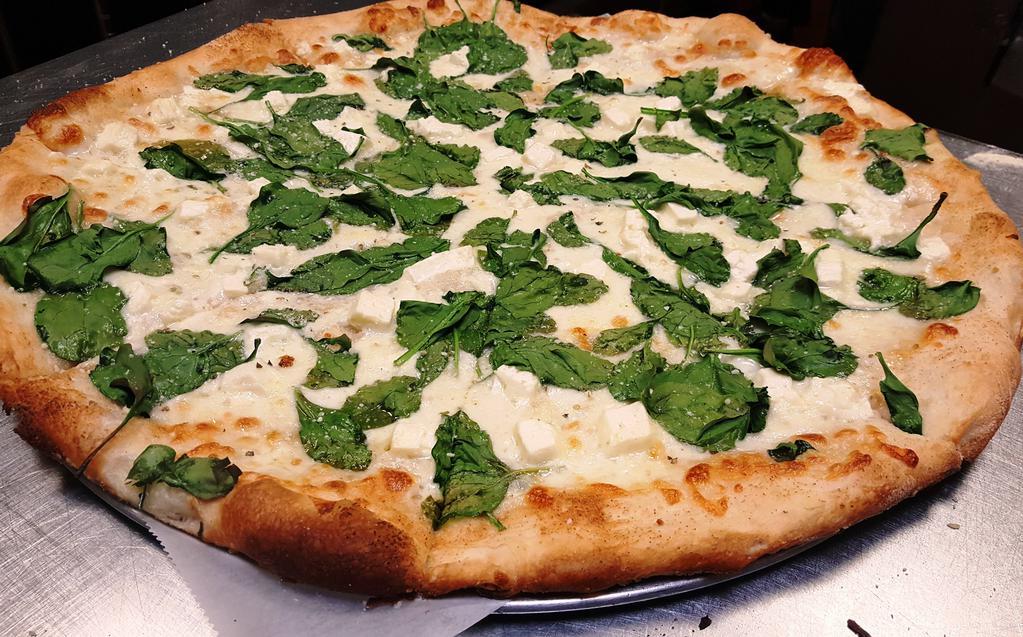 Mediterranean Pizza · A white pizza with fresh garlic, spinach, mozzarella and crumbled feta cheese. 
