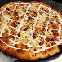 Rancho Pizza · Mozzarella cheese, grilled chicken breast, and crispy bacon drizzled in our ranch dressing.