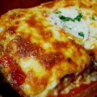 Lasagna (House-made) · Layers of pasta, mozzarella cheese, seasoned ground beef, ricotta & parmesan cheese, and hou...