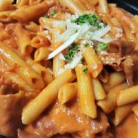 Penne with Prosciutto in Vodka Sauce · Sliced prosciutto in our house-made vodka sauce served over penne pasta. Includes a small, f...