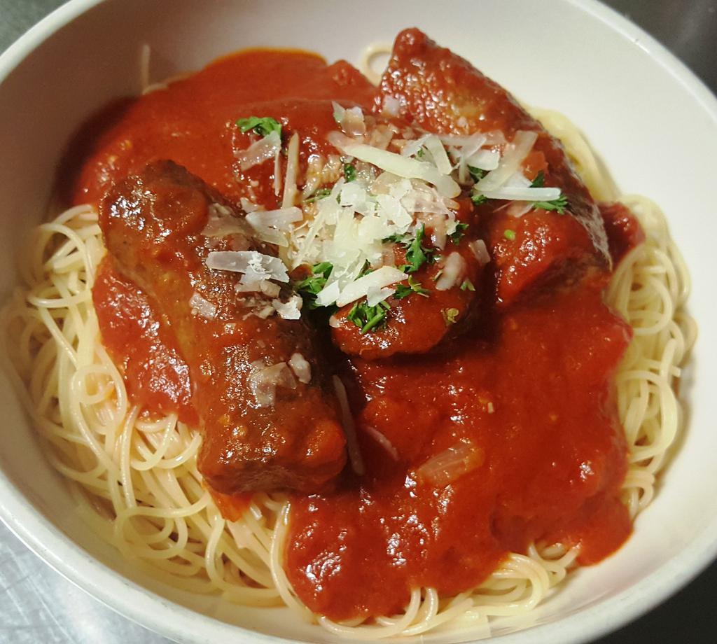 Spaghetti and Sausage · Spicy Italian sausage with house-made marinara sauce. Includes a small, fresh Garden Salad side, dressing, and garlic bread.