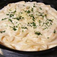 Classic Fettuccine Alfredo · Fettuccine pasta blended with our house-made rich Parmesan Alfredo sauce.  Includes a small,...