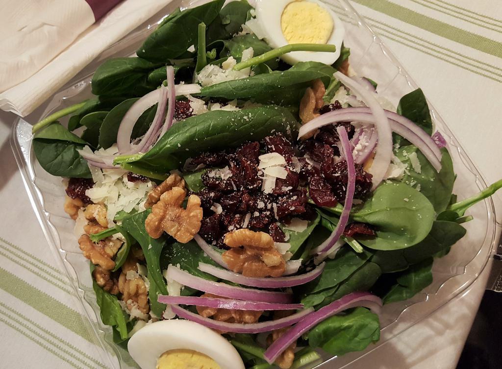 Cranberry Walnut Salad · Baby spinach topped with dried cranberries, crumbled gorgonzola cheese, walnuts, red onions, hard boiled egg and grated pecorino cheese. Served with a toasted sesame dressing. 