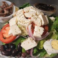 Greek Salad · Romaine lettuce with cucumbers, chunks of feta cheese, Kalamata olives, plum tomatoes, red o...