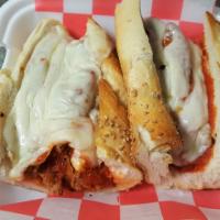 Italian Sausage Parmigiana Sandwich · Hot (spicy) Italian sausage with marinara sauce and oven-melted mozzarella cheese served on ...