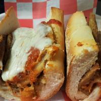 Eggplant Parmigiana Sandwich · Lightly breaded eggplant with marinara sauce and melted mozzarella cheese on a long Italian ...