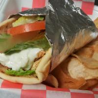 Grilled Chicken Pita · Marinated grilled chicken breast with romaine lettuce, plum tomato, red onion and house-made...