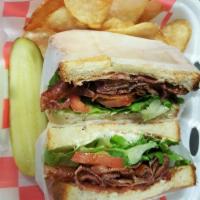 BLT Sandwich · Layered crispy bacon with romaine lettuce, and plum tomato. Sliced pickle and house-made pot...
