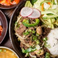 Beef BULGOGI (소불고기) · Tender and caramelized slices of beef with salad, rice, and soup on the side.