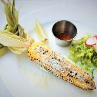 Elote Asado · Grilled fresh corn on the cob with Cotija cheese & mayo. Lime and chili powder on the side