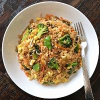 Veggie Fried Rice · Steamed rice stir fried with eggs, peas, carrots and green onions.