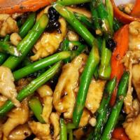 Asparagus Chicken · tender sliced white meat chicken with asparagus and carrots stir fried in a black bean sauce.