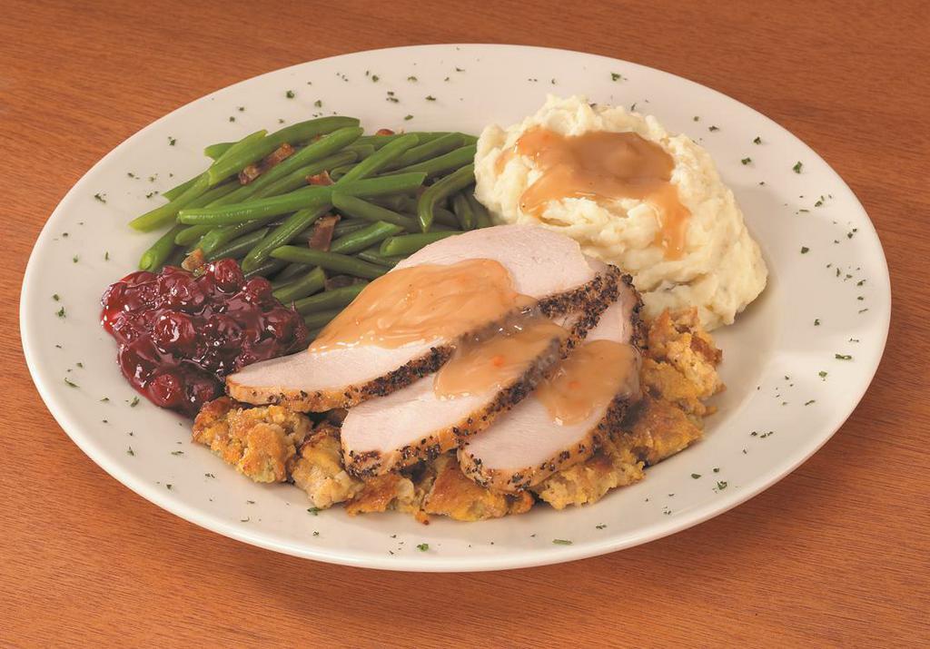 Cracked Pepper Roasted Turkey Breast · Whole butterball turkey breast, roasted daily and served on top of our made from scratch bread dressing and turkey gravy. Served with cranberry sauce and your choice of two vegetables.