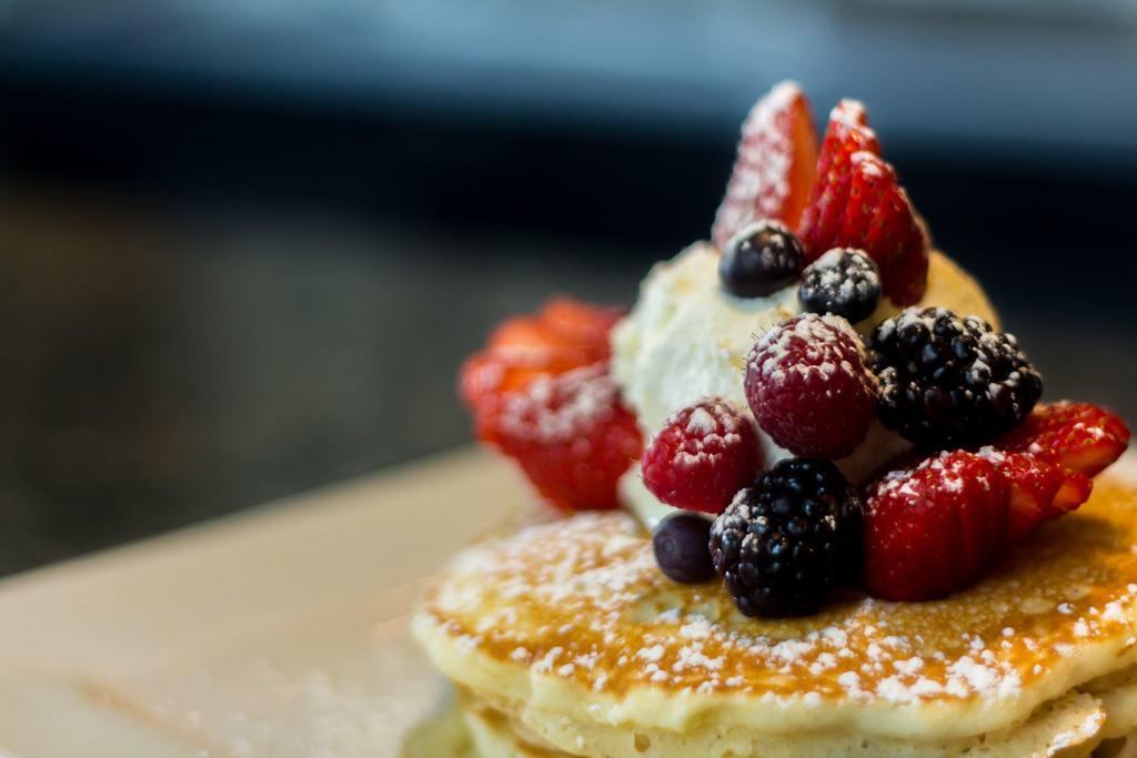 Berries and Mascarpone Pancakes  · 3 fluffy pancakes layered with sweet mascarpone cheese, fresh berries and powdered sugar. 