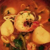Cataplana de Mariscos Algarve · Algarve seafood stew: fish, clams, shrimp, mussels, squid, lobster tail and tomato sauce.
