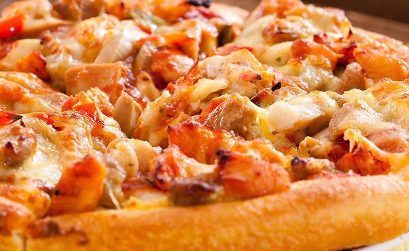 Buffalo Chicken Pizza · Who says your pizza has to be strictly tomato sauce flavored?   Ours comes with a buffalo sauce for the base with buffalo chicken and cheese.