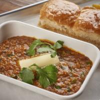Cheese Bhaji Pav · Vegetable curry with spices topped with cheese served with pav.