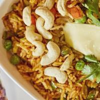 Cheese Pulav · Steamed basmati rice with spices and vegetables topped with cheese.