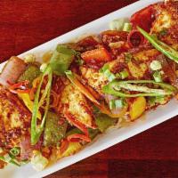 Dry Paneer Chilly · Cottage cheese and green pepper tossed with onion and garlic.