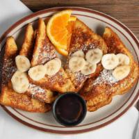 French Toast · 3 thick slices of challah dipped in cinnamon vanilla batter, w orange slices.