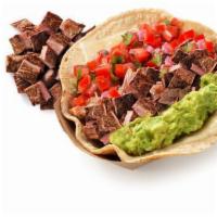 Carne Asada Taco · Loaded tacos served in a soft corn tortilla