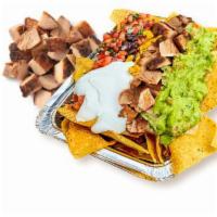 Pollo Asado Nachos · Corn tortilla chips loaded with melted cheese and choice of toppings