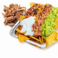 Pork Carnitas Nachos · Corn tortilla chips loaded with melted cheese and choice of toppings