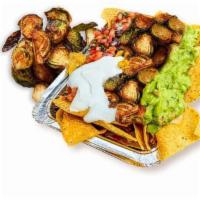 Brussels Nachos · Corn tortilla chips loaded with melted cheese and choice of toppings