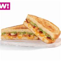 Avocado Grilled Cheese · White American cheese, firehouse cheese blend, bacon, smoked tomato spread and smashed avoca...