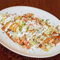Casa Blanca Burrito · Stuffed with rice and refried beans. Topped with lettuce, pico de gallo, sour cream, cotija ...