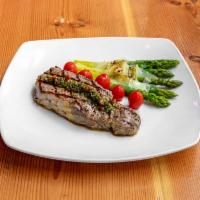 Angus Steak · 12oz aged Angus strip steak, truffle french fries, organic field greens salad, home- made ch...