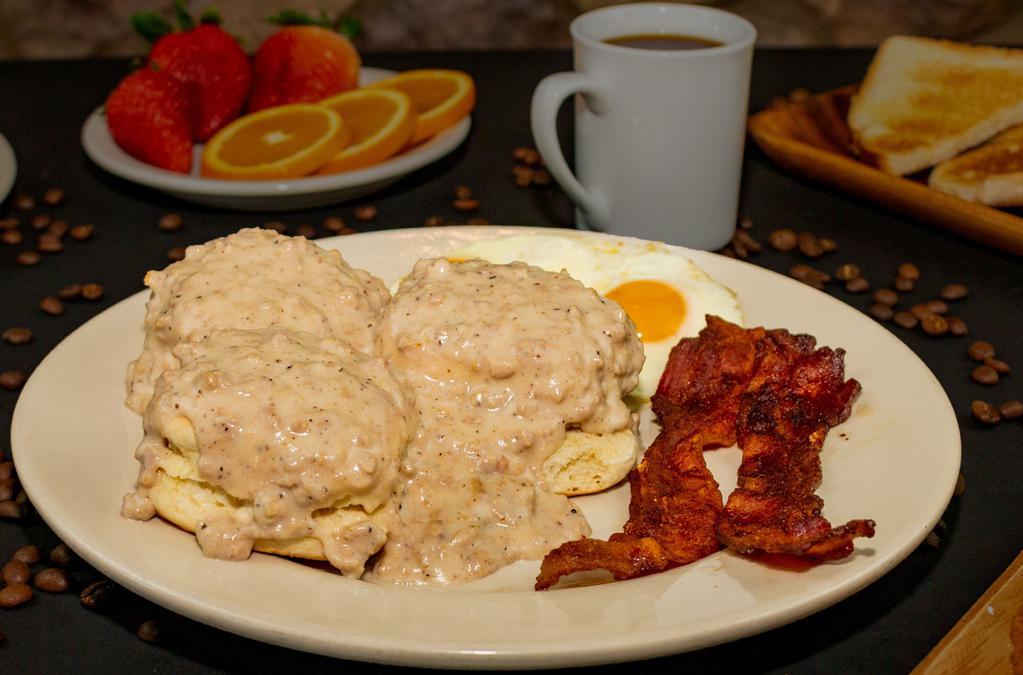 Biscuits and Gravy · Homemade fluffy biscuits smothered in savory sausage gravy. Add 2 eggs, 2 slices of bacon or link sausage for an additional charge.