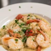 Shrimp Scampi · Eight large shrimp sauteed with cherry tomatoes in a garlic, white wine butter sauce, served...