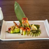 G19. Rainforest Roll · Shrimp tempura, cucumber, and avocado inside, wrapped with soybean paper, topped with salmon...