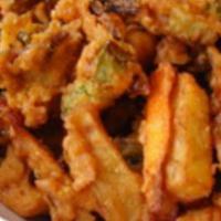 Mix Vegetable Pakora · Mixed vegetables with chick pea flour and spices and deep fried. Vegan.