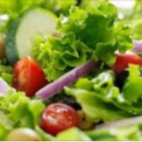 Garden Salad · Fresh romaine and iceberg lettuce, red cabbage grated carrots, sliced cucumber, tomatoes and...