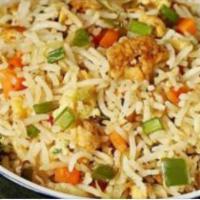 Egg Fried Rice · Aromatic rice stir fried with fine chopped cabbage, carrot, bell peppers and egg. Served wit...