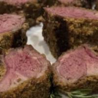 Rack of Lamb · Grilled rack of lamb cooked to order over a cream of garlic sauce. Served with cumin roasted...