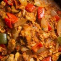 Chicken Jalfrezi · Tender chicken pieces marinated with fresh ground spices and sauteed with tomatoes, onions a...