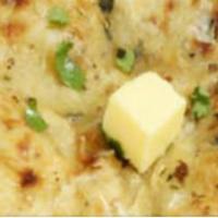 Cheese Naan · Leavened bread stuffed with green cheese.