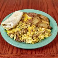 Machaca con Huevos Breakfast · Two eggs any style, served with machaca, beans or potatoes, and your choice of flour tortill...