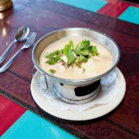 14. Tom Kha Gal Soup · Coconut broth soup with chicken prawns galanga, lemongrass, and Thai herbs. Add prawns for a...