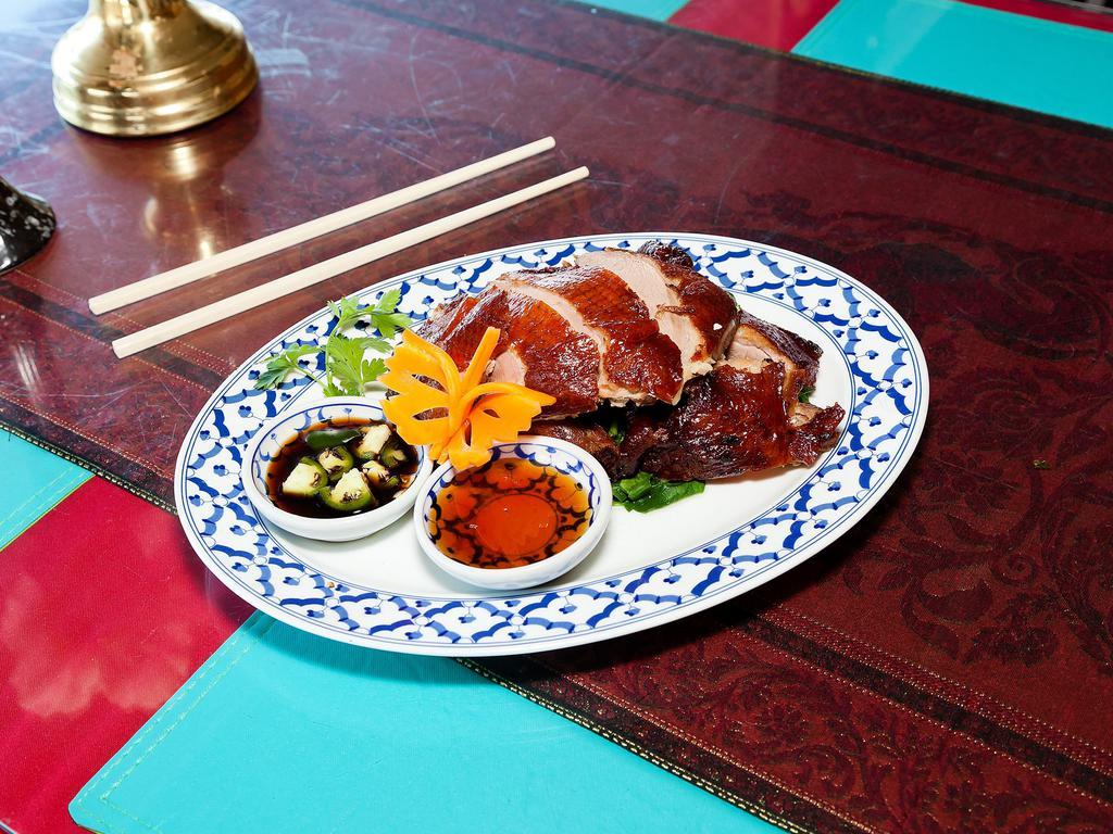51. Sa Wooei Special Duck · Double cooked crispy duck served with homemade plum sauce.