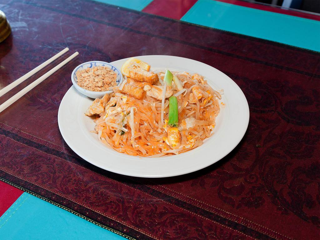 61. Pad Thai Noodles with Chicken · Pan-fried rice noodle, with chicken, egg, fried tofu, bean sprouts, green onions and ground peanut.