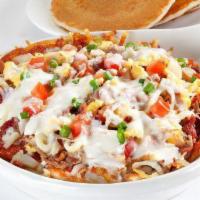 Carnitas Queso Skillet · Two scrambled eggs, pulled pork, bacon, sausage, tomatoes, onions, on a bed of seasones hash...