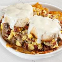 Country Skillet · Two scrambled eggs, crumbled sausage, bacon, mushrooms, onions, on a bed of seasoned hash br...