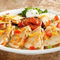 Chicken Quesadilla · Flour tortillas stuffed with chicken breast, onions, tomatoes, cheddar and jack cheeses, ser...