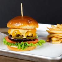 The Classic · Wagyu patty, cheddar cheese, lettuce, tomato, red onion, pickles, and house sauce.